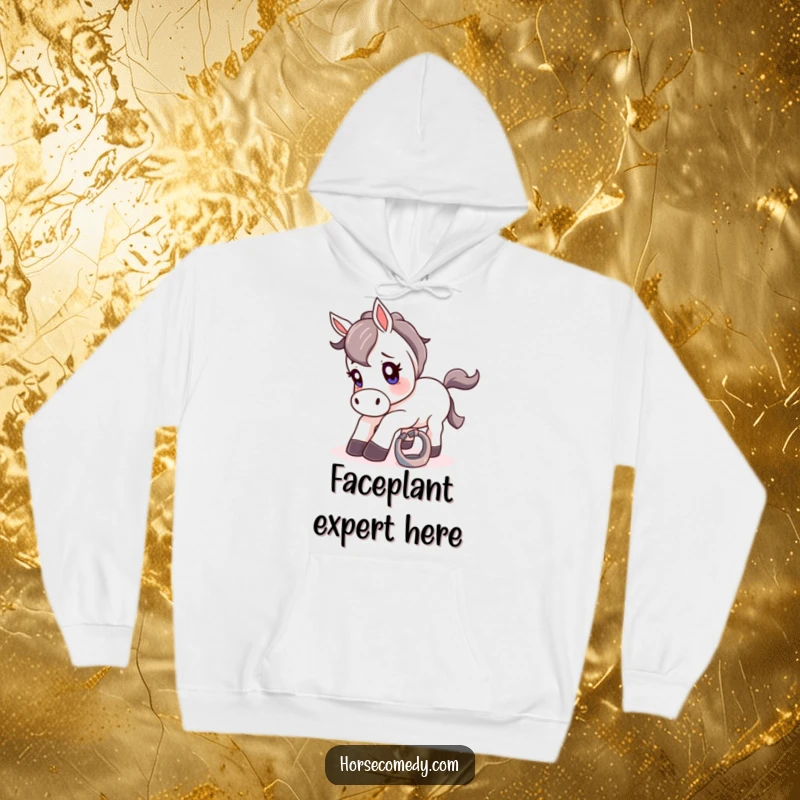 Funny hoodie depicting a horse comically stumbling over a small, shiny horseshoe with a look of pure surprise.