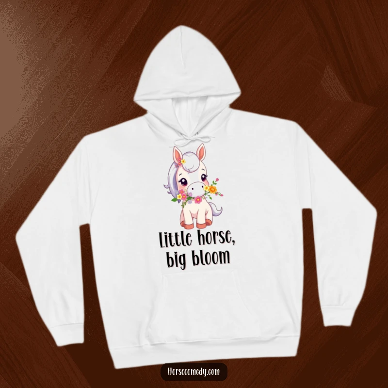 Funny hoodie illustrating a tiny horse animal carrying a beautiful bouquet of flowers in its mouth, exuding adorable charm.