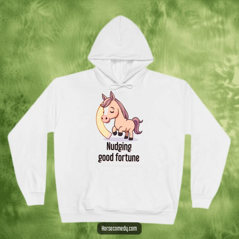 Funny hoodie featuring a playful horse character nudging a giant, glowing horseshoe with its nose, offering warmth and a humorous design.