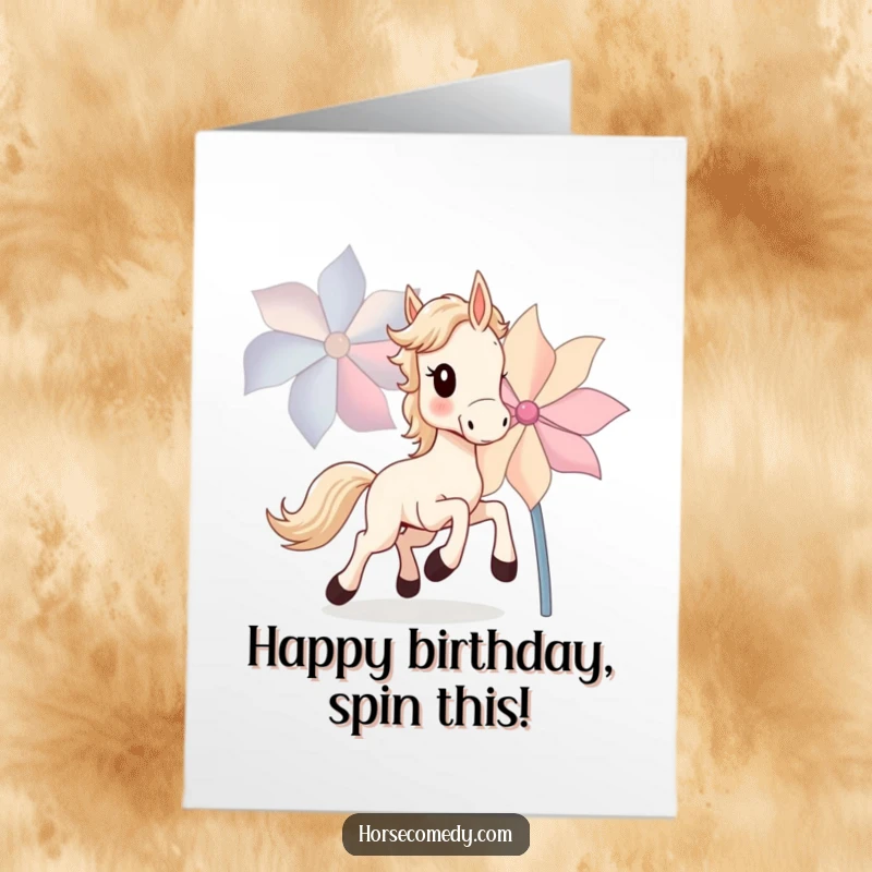 Funny Free Printable Birthday Card featuring a horse cub joyfully chasing a large, brightly spinning pinwheel.